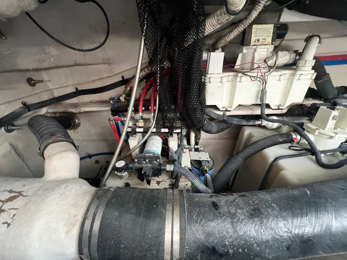  Yacht Photos Pics Engine compartment of 2013 Sea Ray 410 Sundancer with visible hoses and wiring.