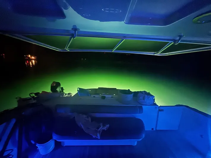 Meccabucks Yacht Photos Pics 2007 Sea Ray 52 Sedan Bridge with blue and green underwater lights at night.