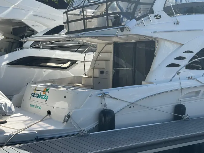 Meccabucks Yacht Photos Pics 2007 Sea Ray 52 Sedan Bridge yacht docked at marina.