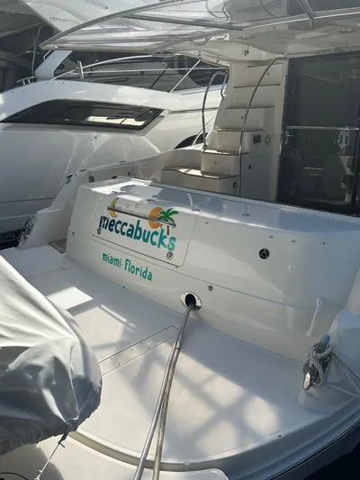 Meccabucks Yacht Photos Pics 2007 Sea Ray 52 Sedan Bridge yacht docked, featuring "Meccabucks" signage, Miami, Florida.