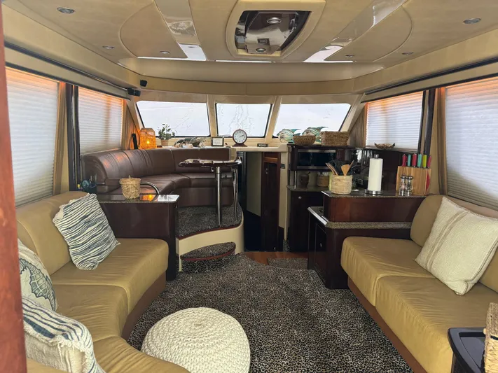 Meccabucks Yacht Photos Pics Luxurious interior of 2007 Sea Ray 52 Sedan Bridge yacht with elegant seating and decor.