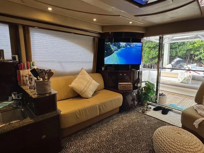 Meccabucks Yacht Photos Pics Luxurious interior of 2007 Sea Ray 52 Sedan Bridge yacht with cozy seating and modern amenities.