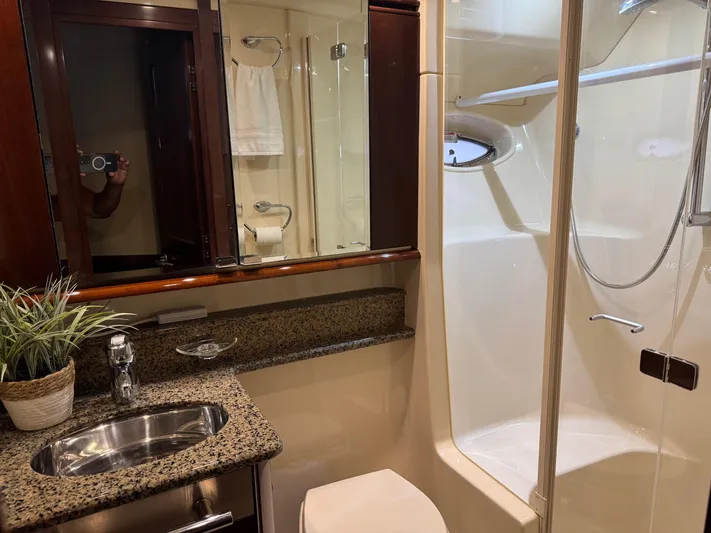 Meccabucks Yacht Photos Pics Luxurious bathroom in 2007 Sea Ray 52 Sedan Bridge yacht with granite countertop and shower.