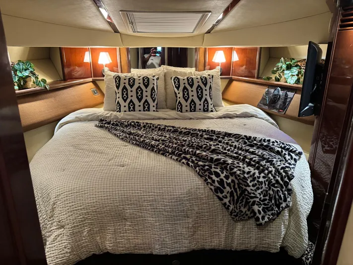 Meccabucks Yacht Photos Pics Luxurious bedroom interior of 2007 Sea Ray 52 Sedan Bridge yacht with elegant bedding.