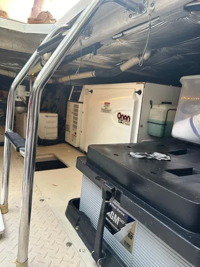 Meccabucks Yacht Photos Pics Engine room of a 2007 Sea Ray 52 Sedan Bridge with equipment and storage.