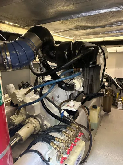 Meccabucks Yacht Photos Pics Engine room of 2007 Sea Ray 52 Sedan Bridge yacht, showcasing mechanical components and wiring.