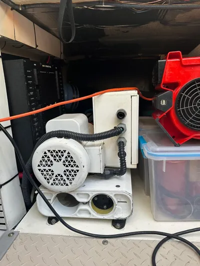 Meccabucks Yacht Photos Pics Engine compartment of a 2007 Sea Ray 52 Sedan Bridge with equipment and storage.