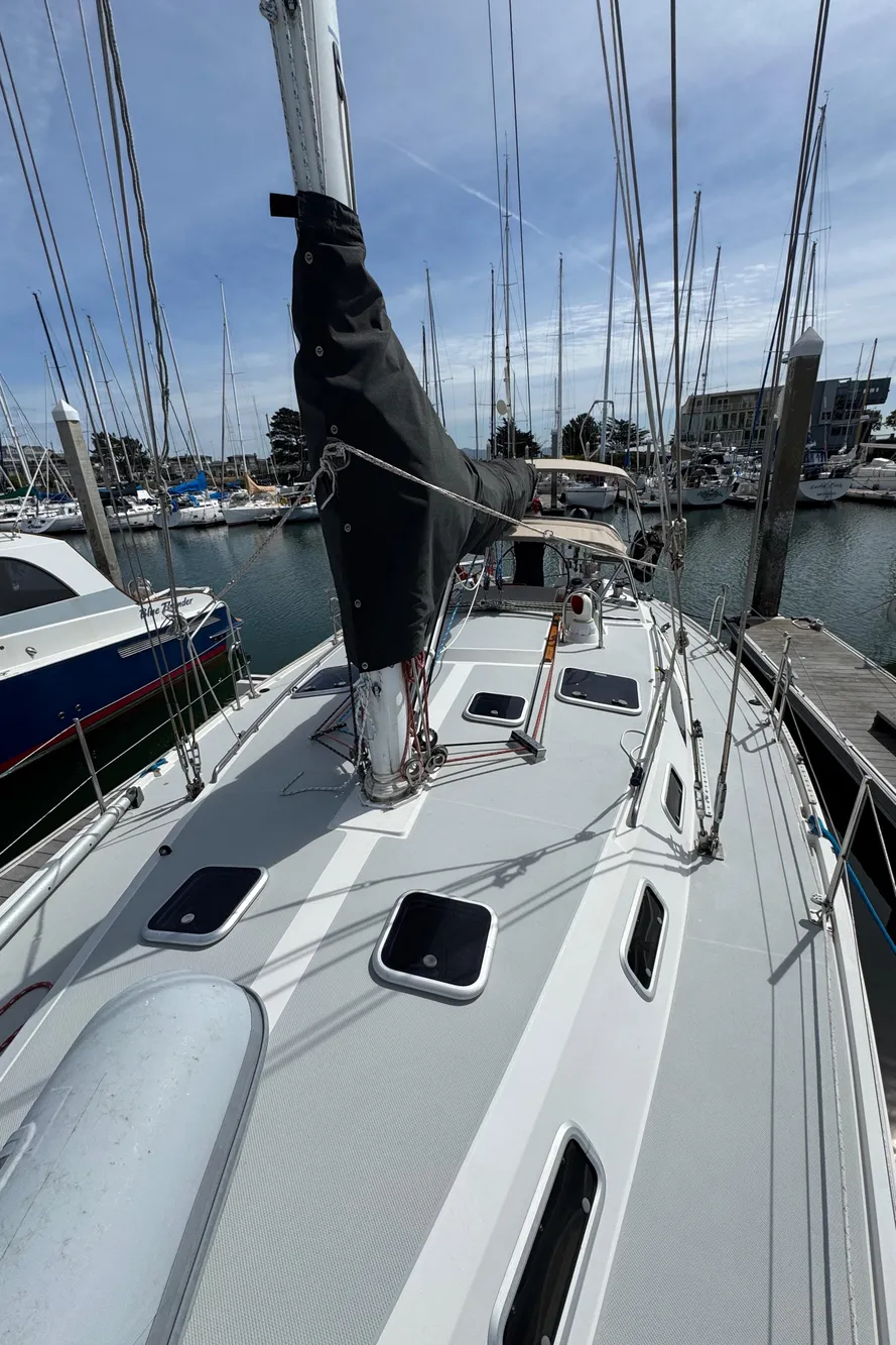 1993 Catalina 42 sailboat docked at marina, showcasing deck and rigging.