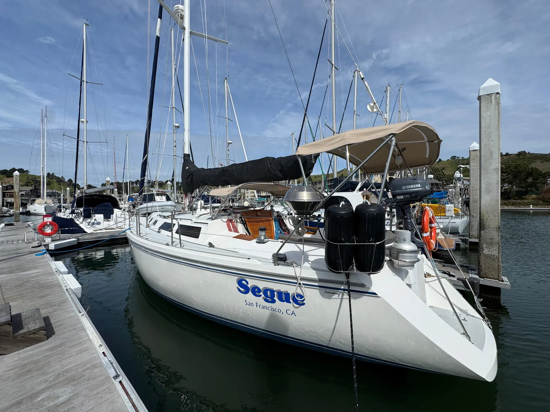 Sailboat docked at marina, 1993 Catalina 42 model, named "Segue" from San Francisco, CA.