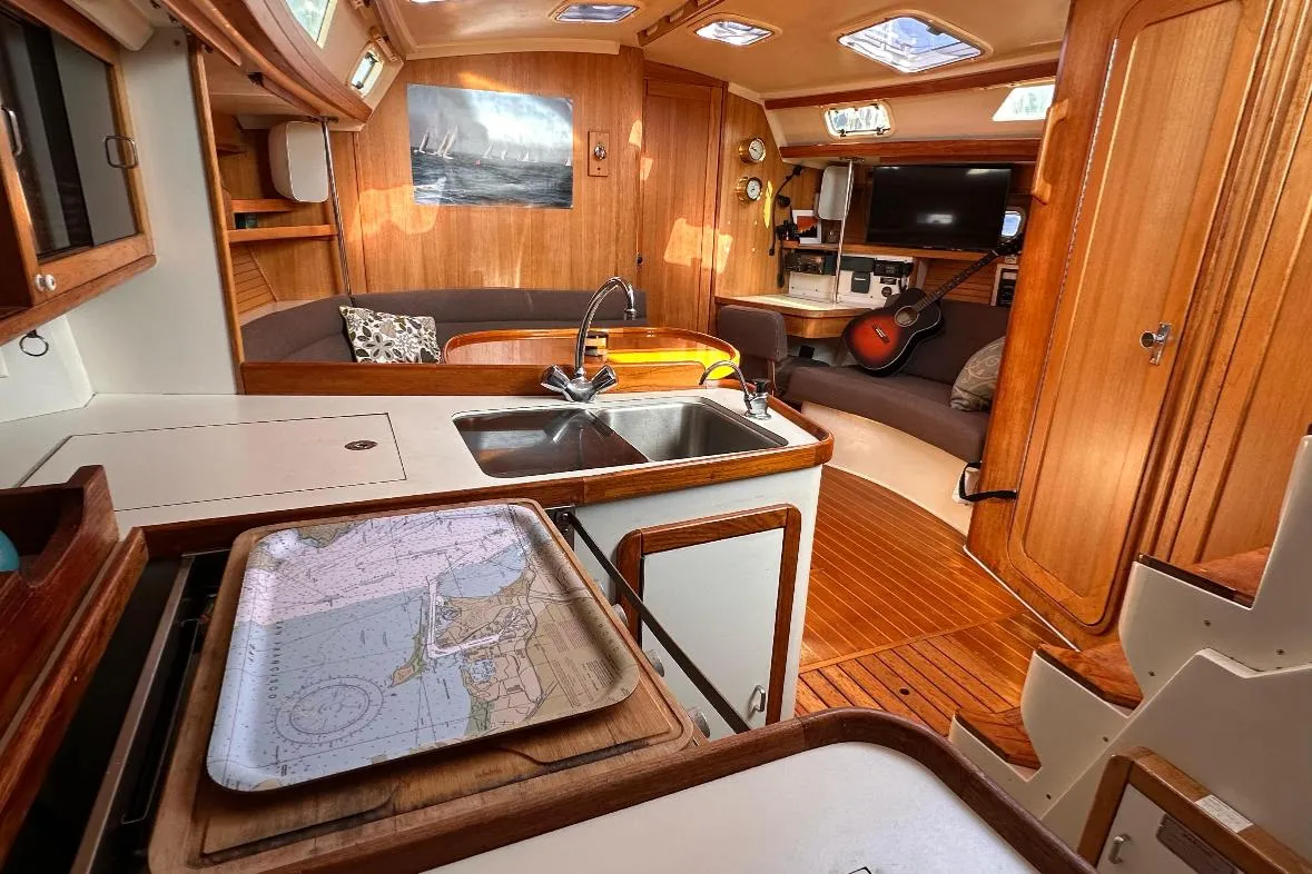 Interior of a 1993 Catalina 42 sailboat with wood finish and modern amenities.