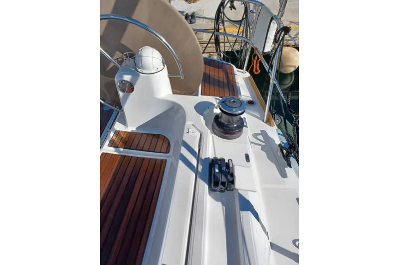Fiesta Yacht Photos Pics 2019 Jeanneau Sun Odyssey 519 yacht deck with winch and wooden flooring.