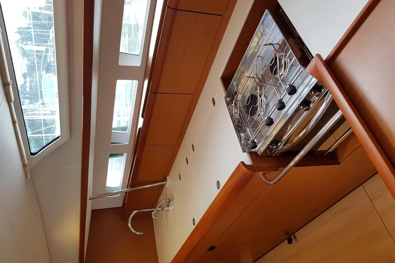 Fiesta Yacht Photos Pics Interior of 2019 Jeanneau Sun Odyssey 519 yacht, featuring modern kitchen and skylights.