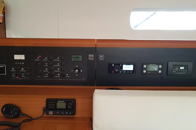 Fiesta Yacht Photos Pics Control panel of a 2019 Jeanneau Sun Odyssey 519 yacht, featuring navigation and communication systems.