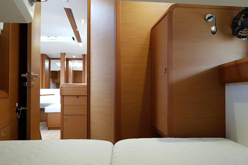 Fiesta Yacht Photos Pics Interior of 2019 Jeanneau Sun Odyssey 519 yacht, featuring wooden cabinetry and modern design.