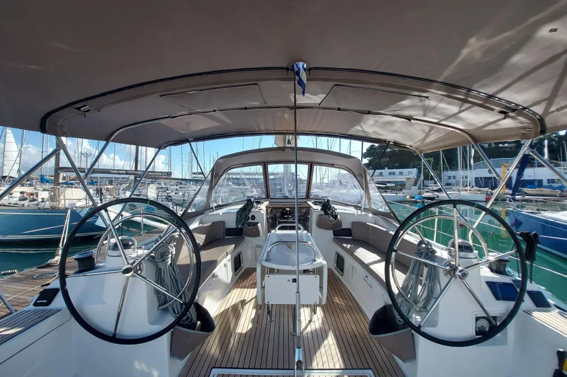 Fiesta Yacht Photos Pics 2019 Jeanneau Sun Odyssey 519 yacht cockpit with dual steering wheels and spacious seating.