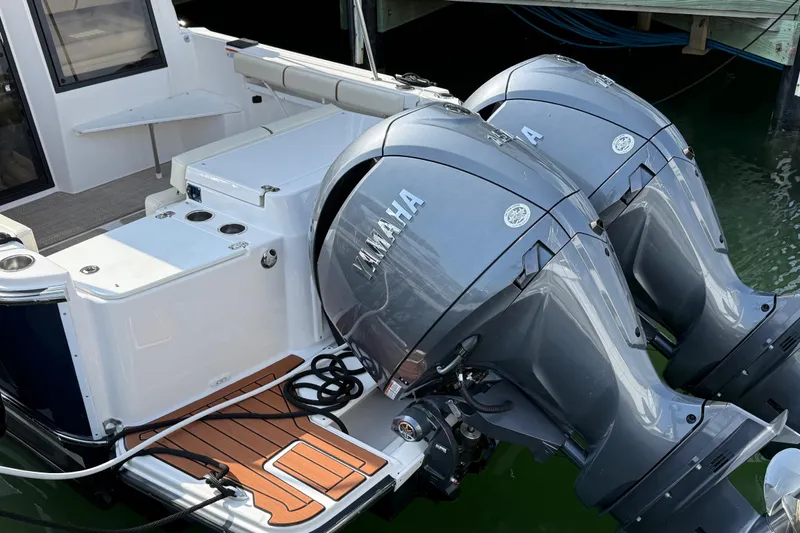  Yacht Photos Pics 2026 Ranger Tugs R-27 with dual Yamaha outboard motors, docked at marina.