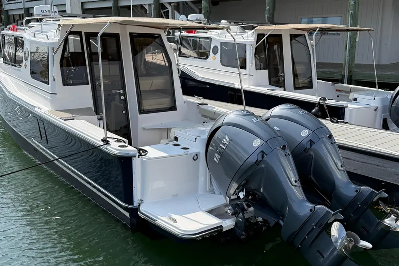  Yacht Photos Pics 2026 Ranger Tugs R-27 boat with dual Yamaha outboard engines docked in marina.