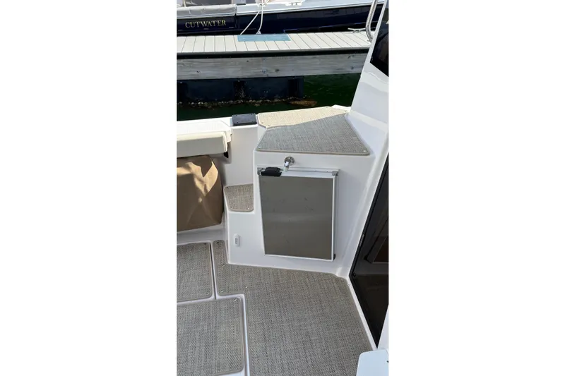  Yacht Photos Pics 2026 Ranger Tugs R-27 boat interior with carpeted flooring and storage compartment.