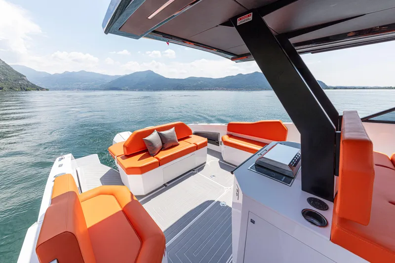  Yacht Photos Pics 2024 Rio Yachts Daytona 35 with orange seating, cruising on a serene lake.