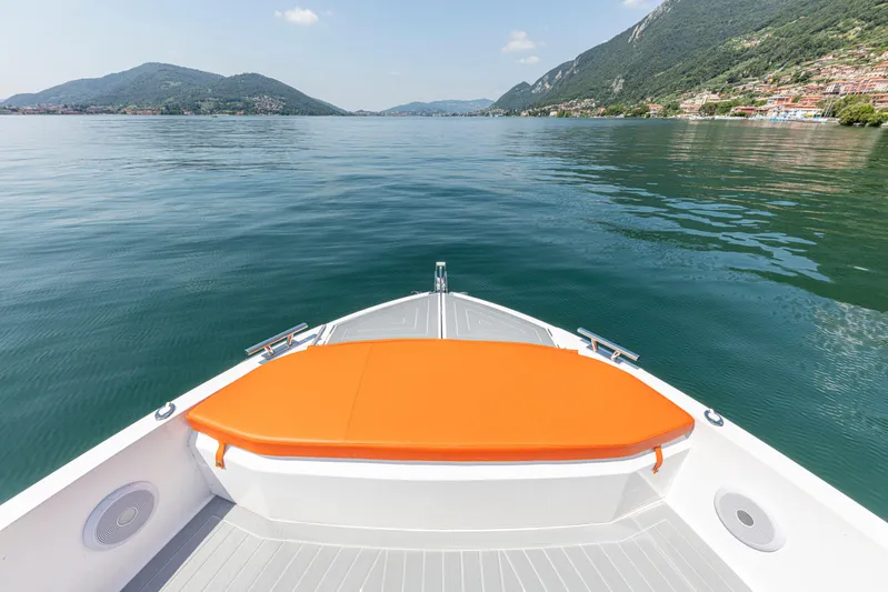  Yacht Photos Pics 2024 Rio Yachts Daytona 35 cruising on a serene lake with mountainous backdrop.