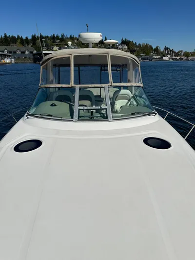  Yacht Photos Pics 2004 Sea Ray 340 Sundancer yacht on calm water, clear sky background.
