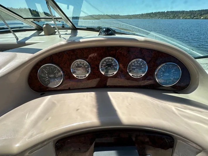  Yacht Photos Pics Dashboard of 2004 Sea Ray 340 Sundancer boat with gauges, on a sunny day.