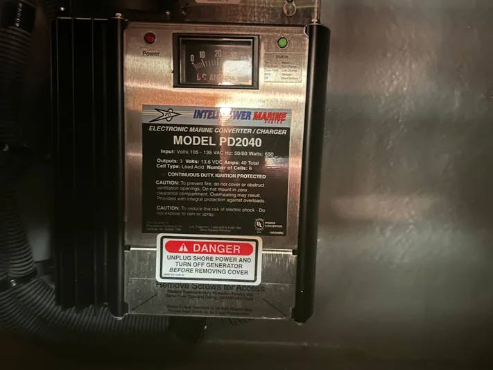  Yacht Photos Pics 2004 Sea Ray 340 Sundancer marine converter charger, model PD2040, with safety warning label.