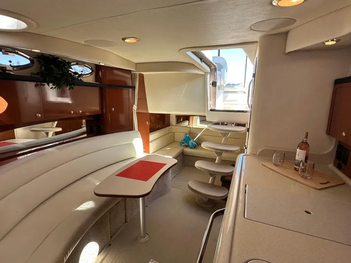  Yacht Photos Pics 2004 Sea Ray 340 Sundancer interior with elegant seating and dining area.