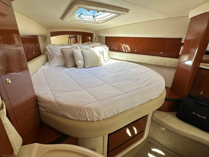  Yacht Photos Pics Luxurious cabin interior of 2004 Sea Ray 340 Sundancer yacht with plush bedding.