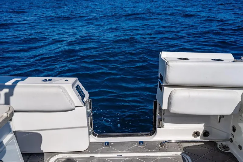 Batavia Yacht Photos Pics 2019 HCB 42 Siesta boat with open transom door on blue ocean water.