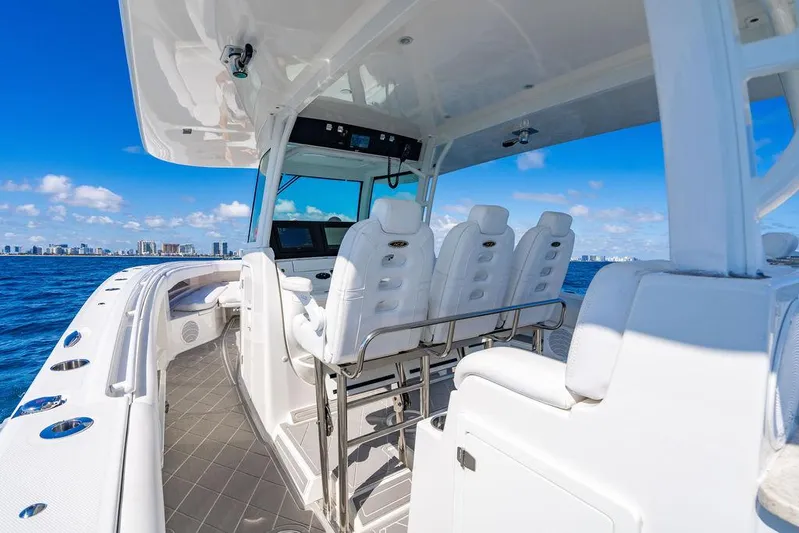 Batavia Yacht Photos Pics 2019 HCB 42 Siesta boat interior with white seating, ocean view, and city skyline.