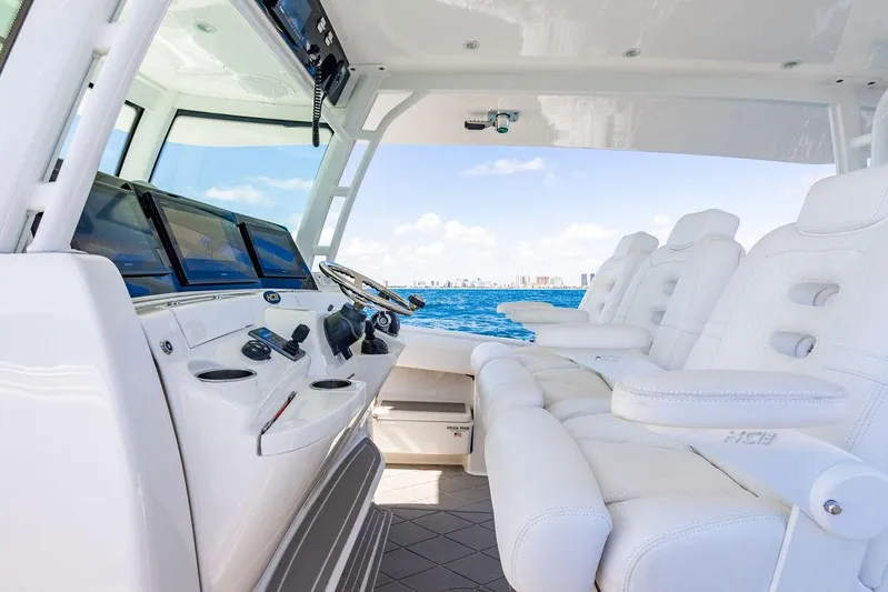 Batavia Yacht Photos Pics Luxurious interior of 2019 HCB 42 Siesta boat with white seating and ocean view.