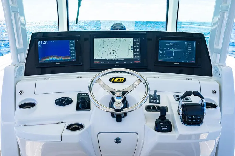 Batavia Yacht Photos Pics Control panel of a 2019 HCB 42 Siesta boat with navigation screens.