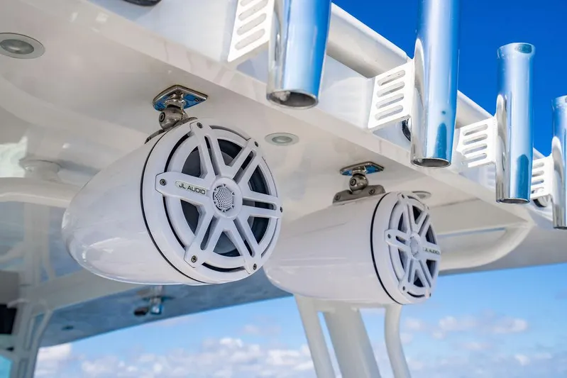 Batavia Yacht Photos Pics Speakers and rod holders on a 2019 HCB 42 Siesta boat against a blue sky.