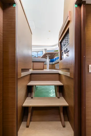 Benedetto Yacht Photos Pics Interior view of 2020 Lagoon 42 yacht, featuring wooden stairs and modern design elements.