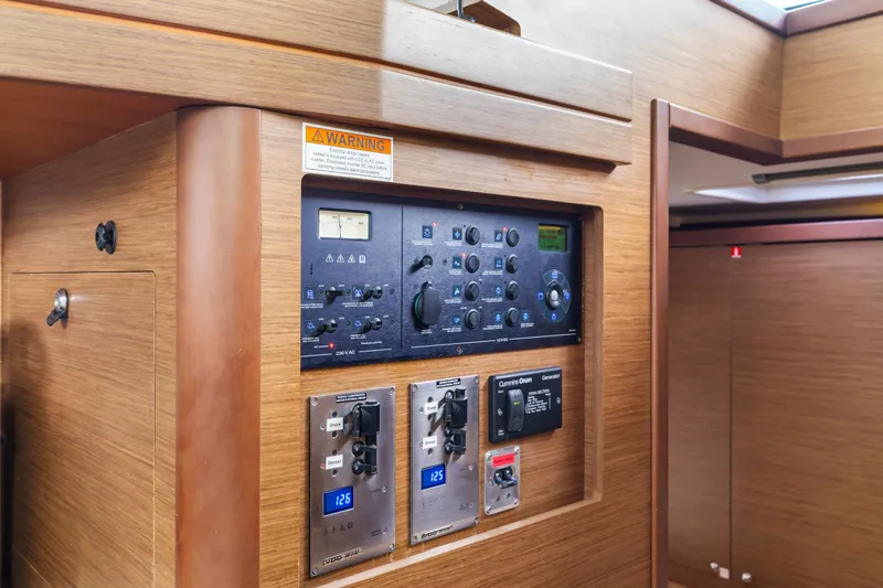 Benedetto Yacht Photos Pics Control panel inside a 2020 Lagoon 42 yacht, featuring various switches and gauges.