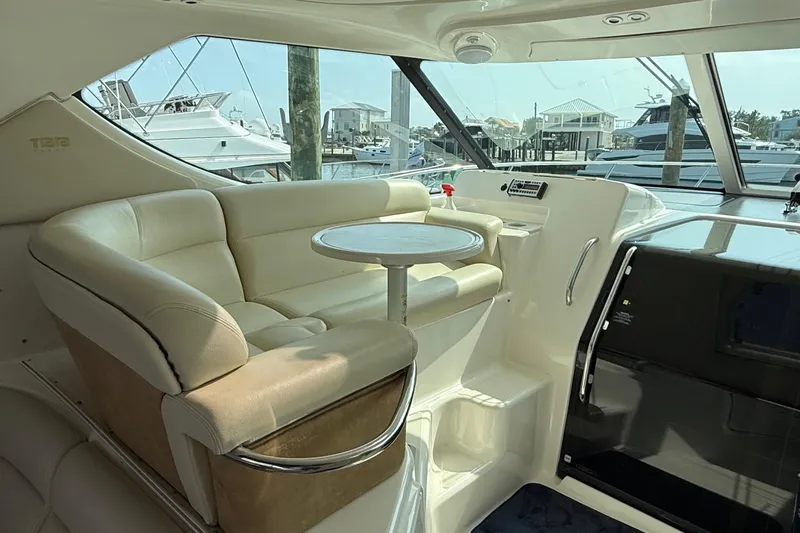  Yacht Photos Pics Luxurious interior of 2007 Tiara Yachts 3900 Sovran with plush seating and round table.