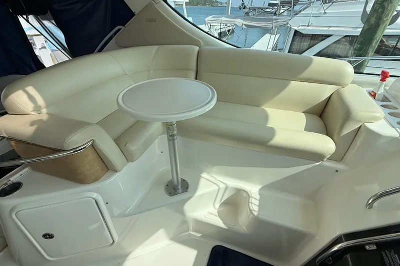  Yacht Photos Pics Luxurious seating area on a 2007 Tiara Yachts 3900 Sovran with a small table.