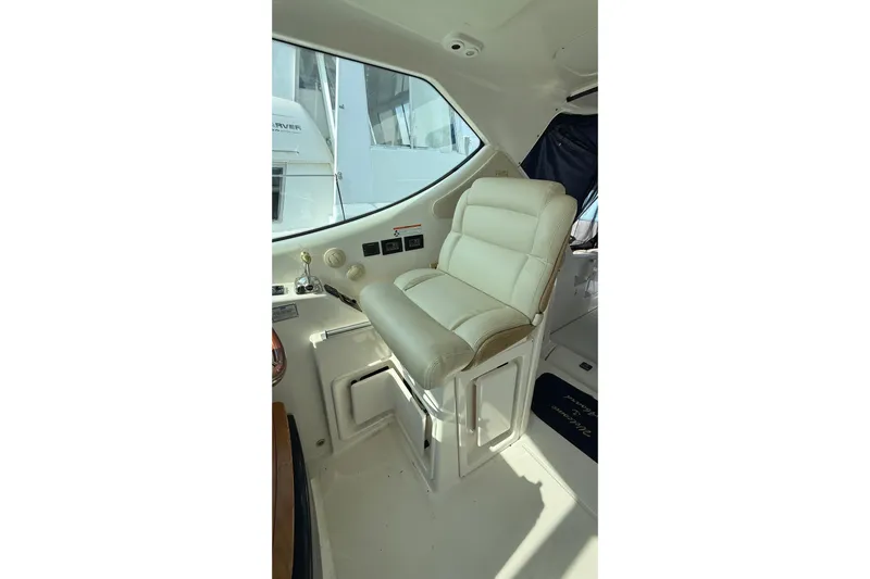  Yacht Photos Pics Captain's chair in 2007 Tiara Yachts 3900 Sovran cockpit, featuring beige upholstery.
