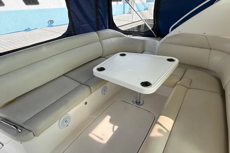  Yacht Photos Pics 2007 Tiara Yachts 3900 Sovran interior with cushioned seating and table.