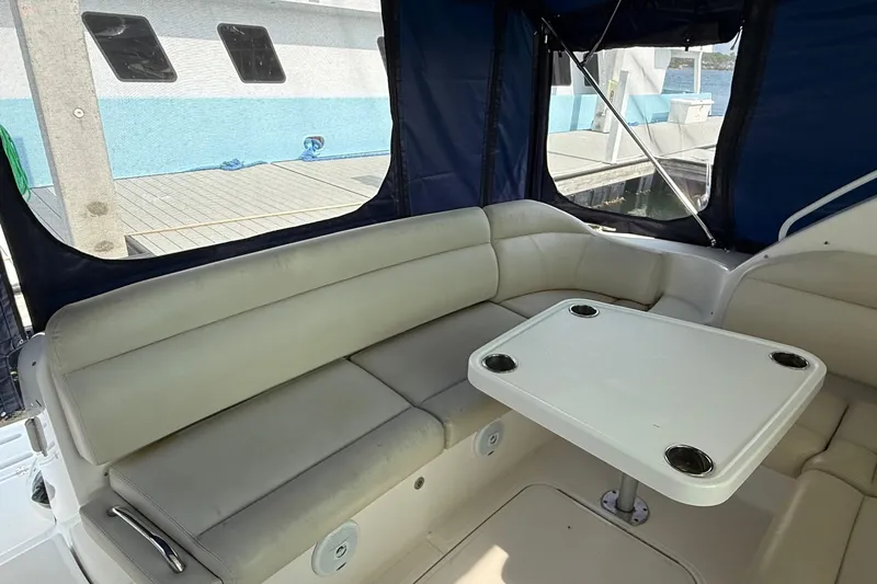  Yacht Photos Pics 2007 Tiara Yachts 3900 Sovran interior with cushioned seating and table, dockside view.