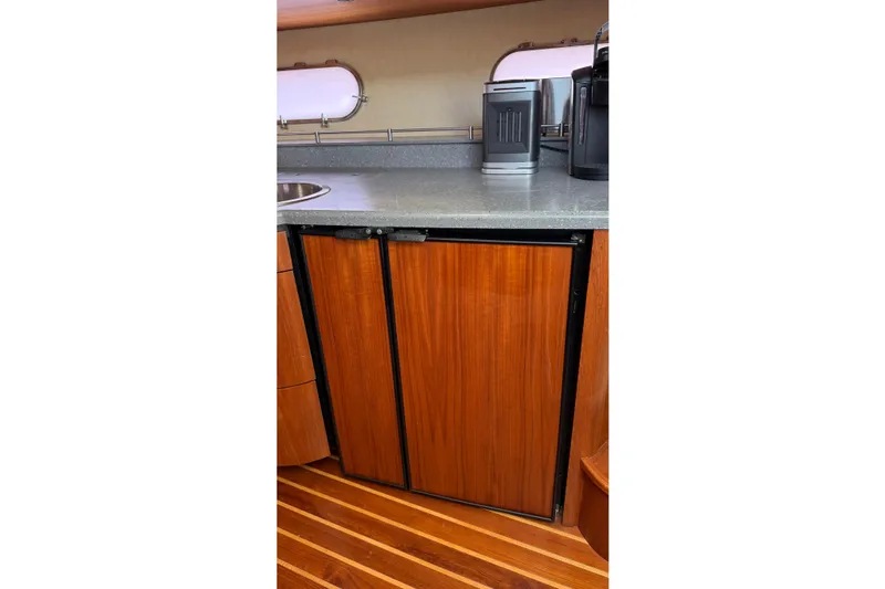  Yacht Photos Pics 2007 Tiara Yachts 3900 Sovran interior with wooden cabinets and modern appliances.