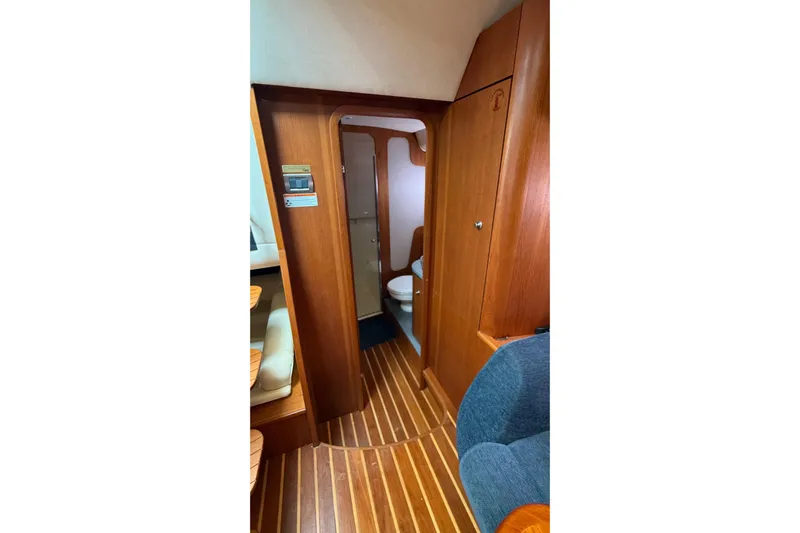  Yacht Photos Pics 2007 Tiara Yachts 3900 Sovran interior with wooden flooring and compact bathroom.