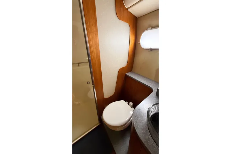 Yacht Photos Pics 2007 Tiara Yachts 3900 Sovran bathroom with modern fixtures and wood accents.