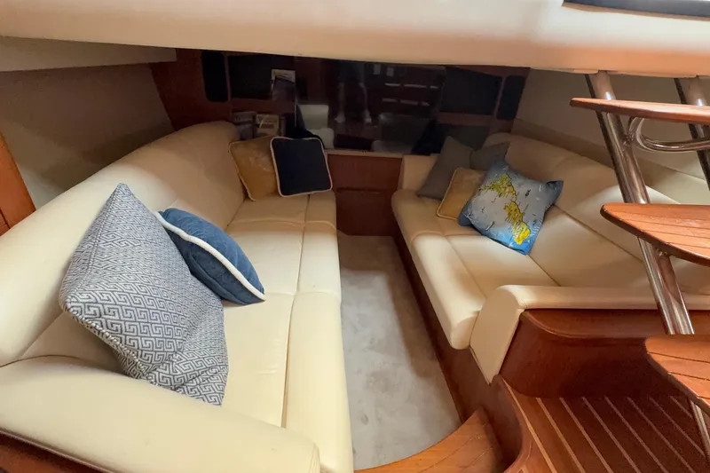 Yacht Photos Pics Luxurious interior of 2007 Tiara Yachts 3900 Sovran with plush seating and decorative pillows.