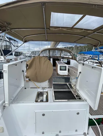 Stellar Yacht Photos Pics Dufour 460 Grand Large 2016 yacht cockpit with open storage and navigation equipment.