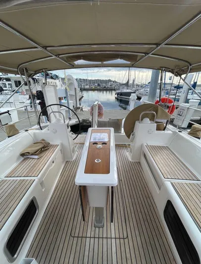 Stellar Yacht Photos Pics Dufour 460 Grand Large 2016 yacht cockpit with teak flooring and dual steering wheels.