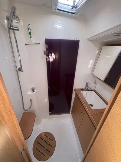 Stellar Yacht Photos Pics Bathroom interior of 2016 Dufour 460 Grand Large yacht, featuring shower and sink.