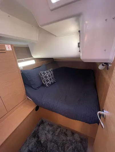 Stellar Yacht Photos Pics Cozy cabin interior of 2016 Dufour 460 Grand Large yacht with plush bedding.