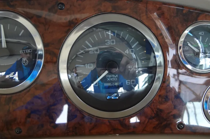 Shel 'b' Gale Yacht Photos Pics Close-up of 2001 Sea Ray 380 Sundancer dashboard gauges, featuring RPM and pressure indicators.